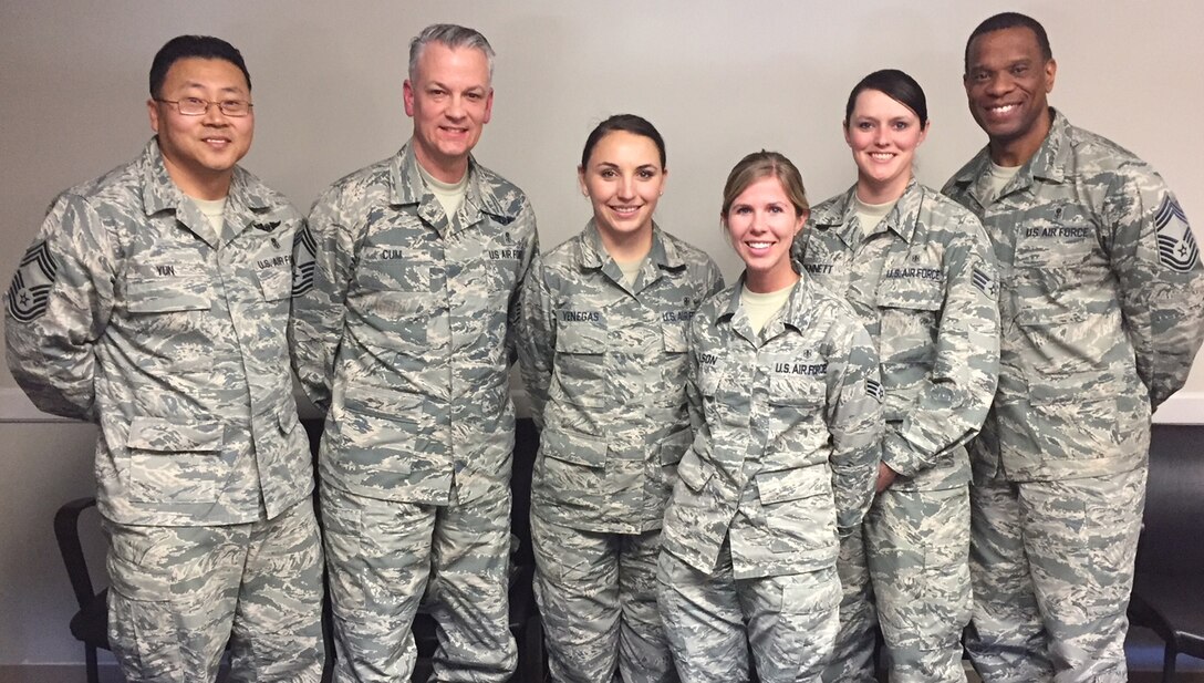 Staff Sgt Alyson Venegas, Senior Airmen Linda Wilson, and Senior Airman Logan Bennett, 99th Medical Group Aerospace Medical Technicians, stand with CMSgt Steven Cum, Chief, Medical Enlisted Force (CMEF) and Enlisted Corps Chief, Office of the Surgeon General. U.S. Air Force, CMSgt Tracy Washington, and CMSgt John Yun at Nellis Air Force Base, Las Vegas, Nev., March 1, 2018. Venegas, Wilson, and Bennett attended the Route 91 Harvest Festival in Las Vegas, Nev., Oct. 1, 2017, when a gunman opened fire on concert-goers, causing the deadliest mass casualty incident in modern American history. While under continuous fire, Venegas, Wilson, and Bennett provided lifesaving trauma interventions to victims of the mass casualty shooting. (U.S. Air Force photo)