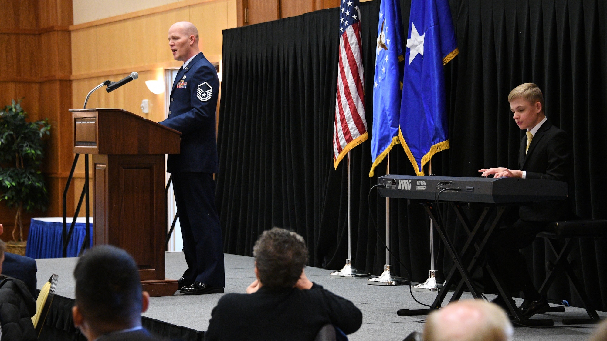 Master Sgt. Jared Graham and his son Tyson perform during the National Prayer Brerakfast at Hill Air Force Base, Utah, March 2, 2018. (U.S. Air Force photo by R. Nial Bradshaw)