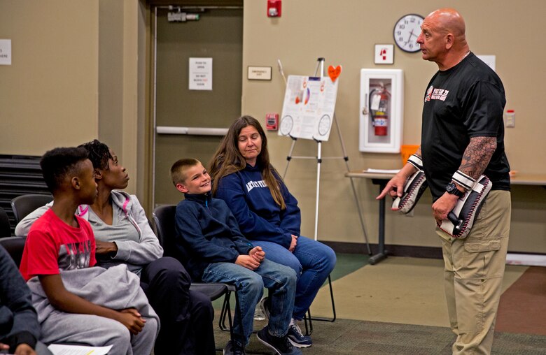 Mark Geletko, the boxing coach for the installation’s Mixed Martial Arts Fight Club 29, teaches a self defense class as part of Teen Dating Violence Awareness month in building 1707 aboard the Marine Corps Air Ground Combat Center, Twentynine Palms, Calif., Feb. 22, 2018. The class was held to give parents and their children the opportunity to learn how to defend themselves in a dangerous situation. (U.S. Marine Corps photo by Lance Cpl. Jennessa Davey)