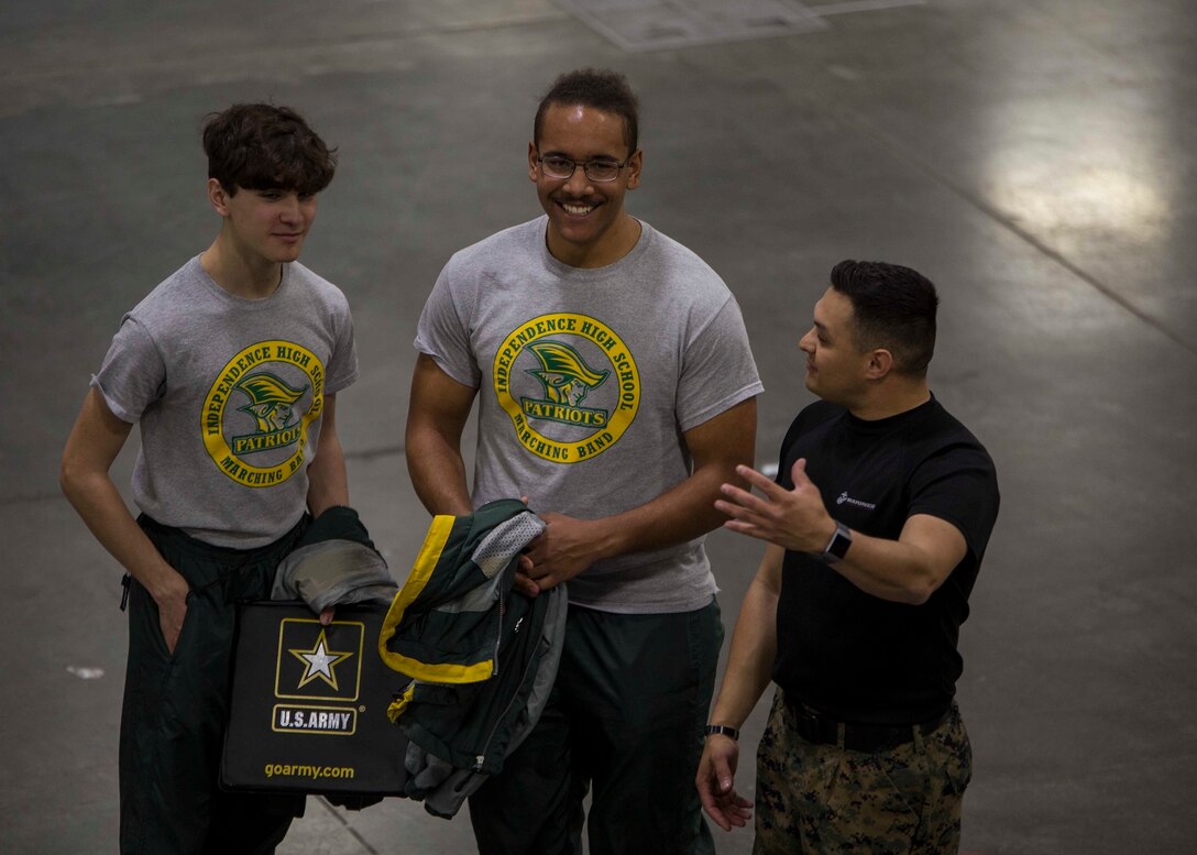 Staff Sergeant Jose O. Nava, the Communication Strategy Chief for 6th Marine Corps District, speaks to attendants of the Central Intercollegiate Athletic Association (CIAA) Fan Festival at the Charlotte Convention Center, Charlotte, North Carolina, on March 3, 2018. The Marines took part in the Fan Festival at the CIAA to spread awareness and inform others of the opportunities the Marine Corps can provide. The Fan Festival assists recruiters by offering them different tools to reach students across the state. (U.S. Marine Corps photo by Lance Cpl. Jack A. E. Rigsby)