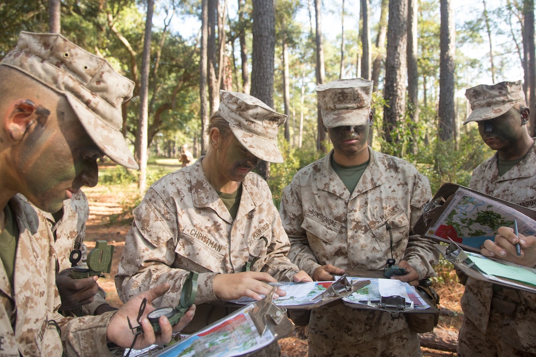 U.S. Marine Corps recruits with Oscar Co., 4th Battalion, Recruit Training Regiment (RTR) and India Co., 3rd Battalion, RTR, record their destination points during a land navigation course at Elliot’s Beach on Marine Corps Recruit Depot, Parris Island, S.C., Nov. 6, 2017.
