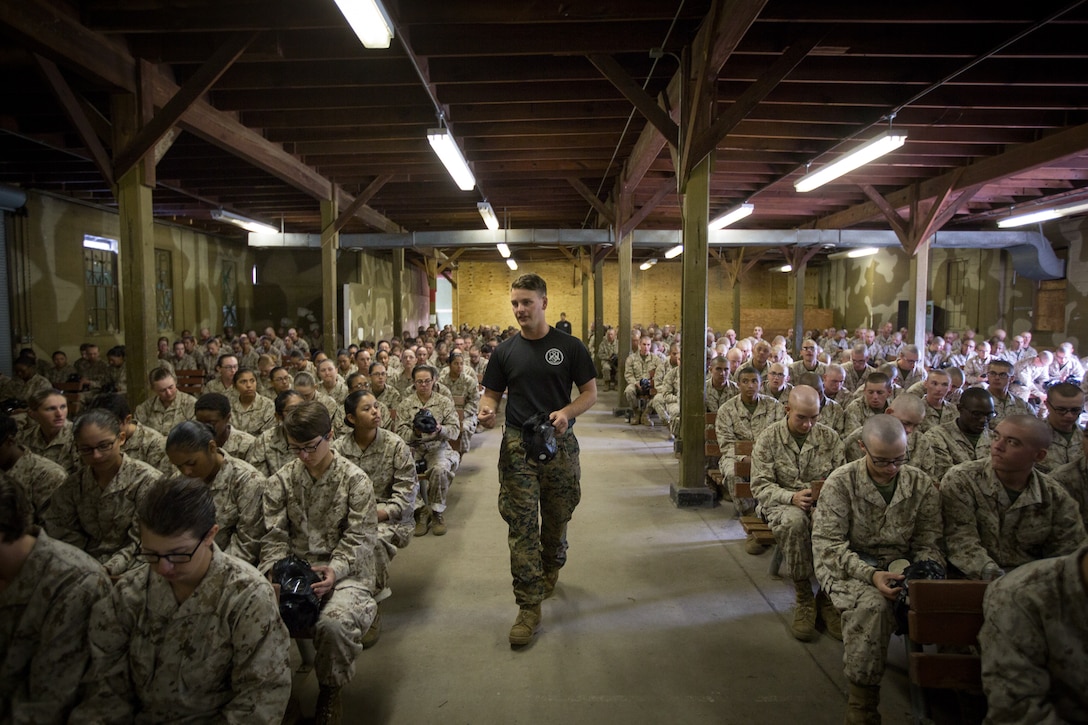 U.S. Marine Corps Sgt. James R. Hochstetler, an instructor with Weapons and Field Training Battalion, explains how to assemble a gas mask Nov. 14, 2017, on Parris Island, S.C. Field training instructors, like Hochstetler, 24, from Manchester, Va., are responsible for teaching recruits how to use the gas mask and ensuring they can properly put the mask on while inside the gas chamber. Fox and Oscar Company are scheduled to graduate Jan. 5, 2018. Parris Island has been the site of Marine Corps recruit training since Nov. 1, 1915. Today, approximately 19,000 recruits come to Parris Island annually for the chance to become United States Marines by enduring 12 weeks of rigorous, transformative training. Parris Island is home to entry-level enlisted training for approximately 49 percent of male recruits and 100 percent of female recruits in the Marine Corps. (U.S. Marine Corps photo by Cpl. Joseph Jacob)
