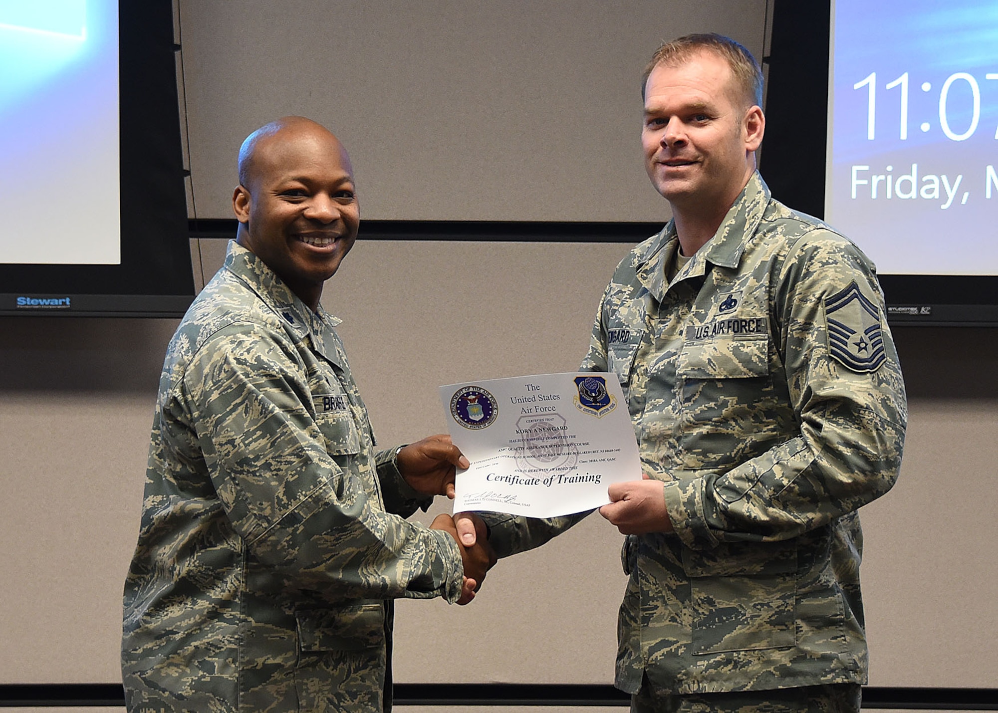 Lt. Col. Patrick Brady-Lee, 423rd Mobility Training Squadron commander, presents Senior Master Sgt. Kory Newgard, 521st Air Mobility Operations Group superintendent, a certificate of completion for the AMC Quality Assurance Supervision course, at Joint Base McGuire-Dix-Lakehurst, March 2, 2018. The course was designed to address trending deficiencies in quality assurance supervision by enhancing student’s knowledge in executing the roles and responsibilities of QA superintendents and chief inspectors. (U.S. Air Force photo by Tech. Sgt. Jamie Powell)