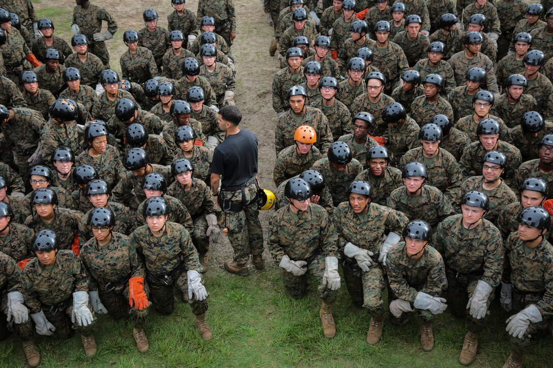 U.S. Marine Corps recruits with Oscar Company, 4th Battalion and Mike Company, 3rd Battalion, Recruit Training Regiment, attend a class on rope techniques on Marine Corps Recruit Depot, Parris Island, S.C., June 6, 2017. Recruits learn both fast roping and rappeling techniques. (U.S. Marine Corps photo by Cpl. Richard Currier/released)