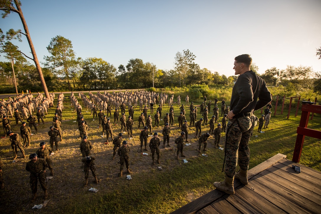 U.S. Marine Corps Staff Sgt. Christopher D. Hobb, a field training instructor with Weapons and Field Training Battalion, demonstrates how to properly tie and tighten a rope harness Oct 4, 2017, to recruits of Hotel Company, 2nd Recruit Training Battalion, and Oscar Company, 4th Recruit Training Battalion, on Parris Island, S.C.