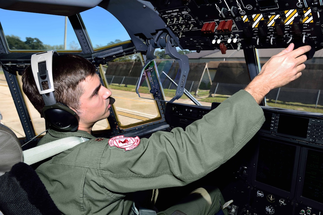 Maj. Kevin Olsen, 815th Airlift Squadron pilot, performs a preflight check on a C-130J Super Hercules aircraft March 2 at Keesler Air Force Base, Mississippi, before taking off in support of Emerald Warrior 2018. The 815th AS “Flying Jennies” provided airlift support for the special operations joint training event at Hurlburt Field, Florida, Feb. 26-March 2. The exercise involved units from all U.S. military branches, U.S. Special Operations Command and North Atlantic Treaty Organization partner forces. (U.S. Air Force photo by Tech. Sgt. Ryan Labadens)