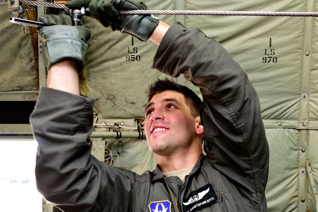 Senior Airman Chris Soto, 815th Airlift Squadron loadmaster, installs an anchor cable stop for the towed parachutist retrieval system on a C-130J Super Hercules aircraft March 2 at Keesler Air Force Base, Mississippi, before taking off in support of Emerald Warrior 2018. The 815th AS “Flying Jennies” provided airlift support for the special operations joint training event at Hurlburt Field, Florida, Feb. 26-March 2. The exercise involved units from all U.S. military branches, U.S. Special Operations Command and North Atlantic Treaty Organization partner forces.  (U.S. Air Force photo by Tech. Sgt. Ryan Labadens)