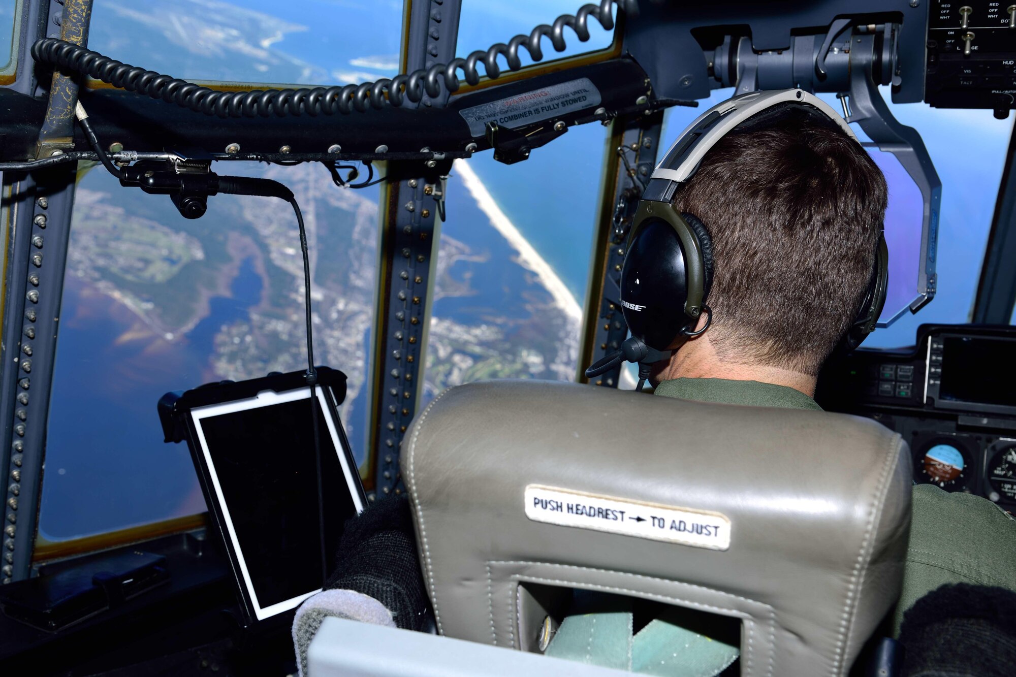 Maj. Kevin Olsen, 815th Airlift Squadron pilot, banks a C-130J Super Hercules aircraft over the U.S. Gulf Coast March 2 during Emerald Warrior 2018. The 815th AS “Flying Jennies” provided airlift support for the special operations joint training event at Hurlburt Field, Florida, Feb. 26-March 2. The exercise involved units from all U.S. military branches, U.S. Special Operations Command and North Atlantic Treaty Organization partner forces.  (U.S. Air Force photo by Tech. Sgt. Ryan Labadens)