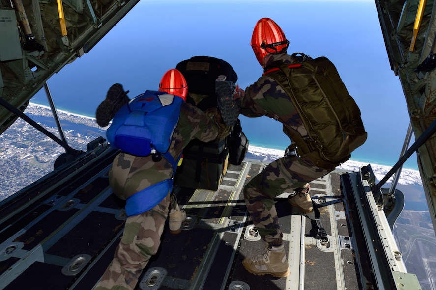 Special Forces members jump out the back of a C-130J Super Hercules aircraft with their equipment March 2 during Emerald Warrior 2018. The 815th AS “Flying Jennies” from Keesler Air Force Base, Mississippi, provided airlift support for Emerald Warrior 2018, a special operations joint training event involving various units from all U.S. military branches, the U.S. Special Operations Command and North Atlantic Treaty Organization partner forces from Feb. 26 to March 9. (U.S. Air Force photo by Tech. Sgt. Ryan Labadens)
