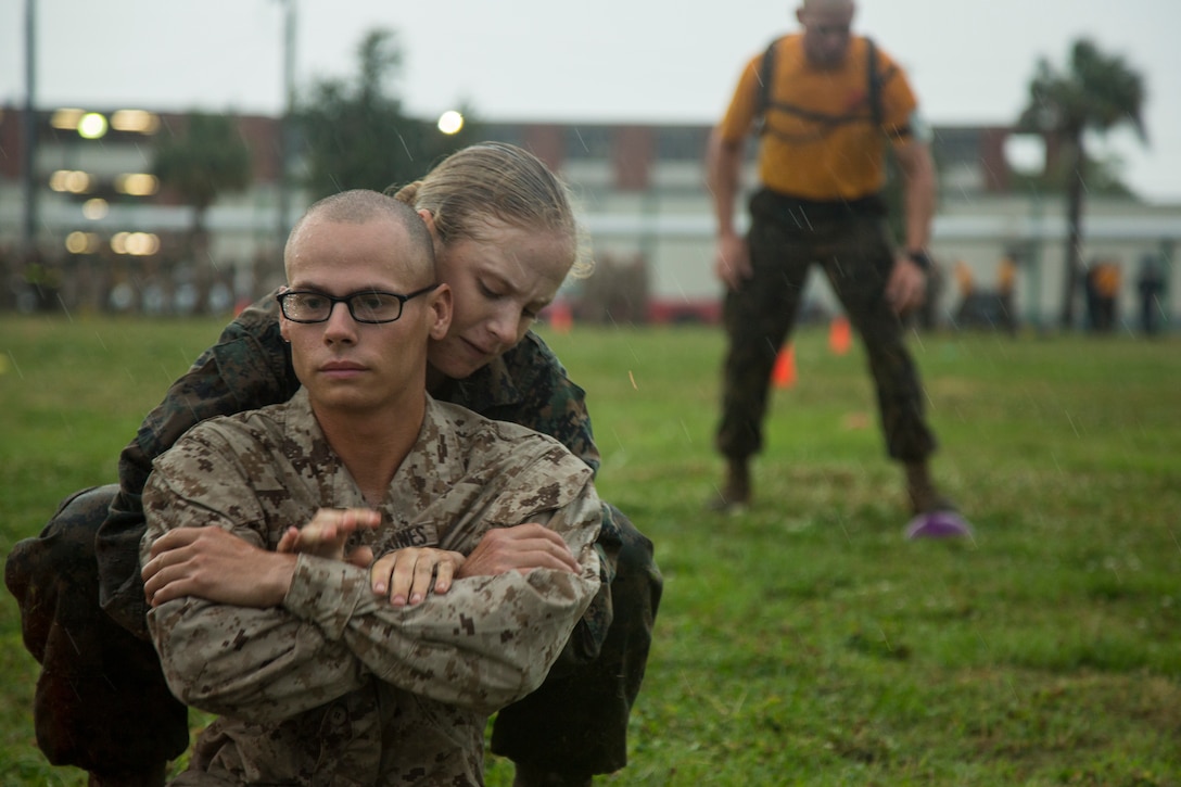 U.S. Marine Corps Recruits with Company O, 4th Battalion and Company G, 2nd Battalion move through the maneuver under fire portion of the Combat Fitness Test during an initial CFT on Marine Corps Recruit Depot, Parris Island, S.C.