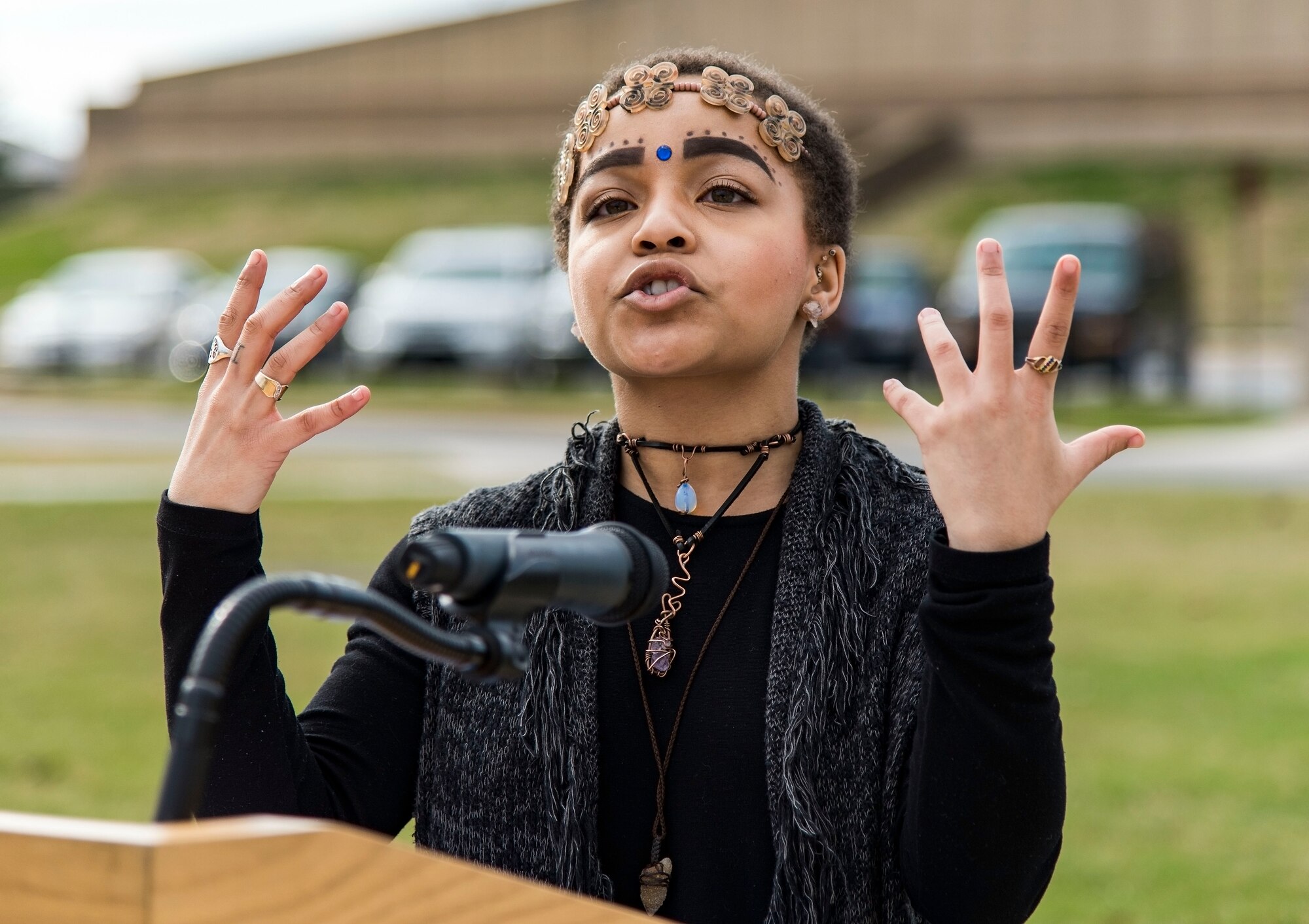 Ikira Peace, guest speaker for the Black History Month Unity Walk, asks attendees to soak in the purpose of why they are here today, Feb. 28, 2018, on Dover Air Force Base, Del. Peace, a native of Baltimore, Md., and a senior at the University of Delaware, Newark, Del., is scheduled to graduate with a Bachelor of Arts in Interpersonal Communications and a double minor in Organizational & Community Leadership and Dance. (U.S. Air Force photo by Roland Balik)