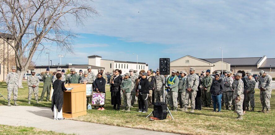 Ikira Peace, guest speaker for the Black History Month Unity Walk, speaks to attendees Feb. 28, 2018, on Dover Air Force Base, Del. The three-quarter mile Unity Walk was hosted by the African-American Heritage Committee in celebration of Black History month here at Dover AFB. (U.S. Air Force photo by Roland Balik)