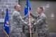 The 167th Mission Support Group commander, Col. Rodney Neely, passes the 167th Logistics Readiness Squadron guidon to Maj. Christopher Tusing during a change of command ceremony, Feb. 4.