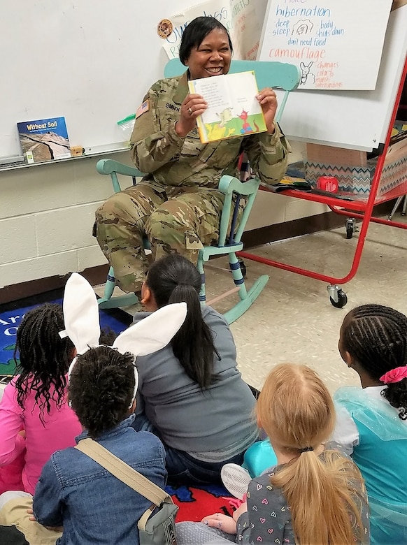 80th Training Command Soldier Staff Sgt. Catherine Smith reads to children at Hopkins Elementary School in Chesterfield, Virginia, on March 2, 2018, in celebration of Dr. Seuss' birthday, which is part of the National Read Across America Day.