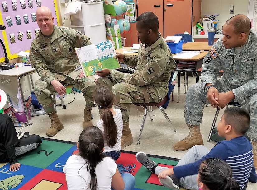 Brig. Gen. Fletcher Washington, deputy commanding general of the 80th Training Command, reads to children at Hopkins Elementary School in Chesterfield, Virginia, on March 2, 2018, in celebration of Dr. Seuss' birthday, as part of the National Read Across America Day.