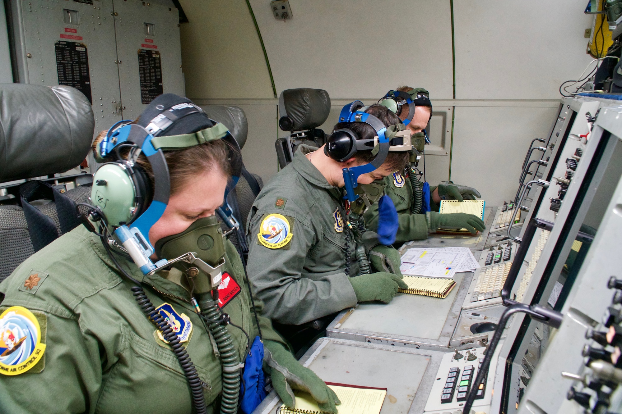 A crew member with the 513th Air Control Group, perform system checks before departing for Sentry Aloha exercises.