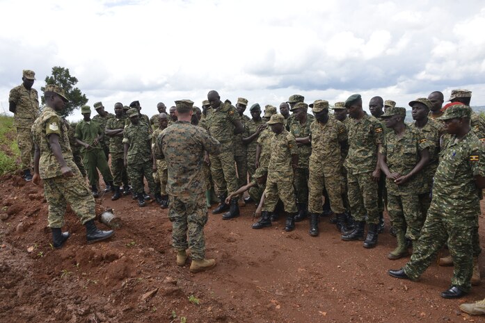 A U.S. Marine with Special Purpose Marine Air-Ground Task Force-Crisis Response-Africa teaches Uganda People’s Defense Force soldiers how to detect improvised explosive devices during a two-day training course at Camp Jinja, Uganda on Nov. 9, 2017. SPMAGTF-CR-AF Marines are deployed to conduct limited crisis-response and theater-security operations in Europe and Africa.