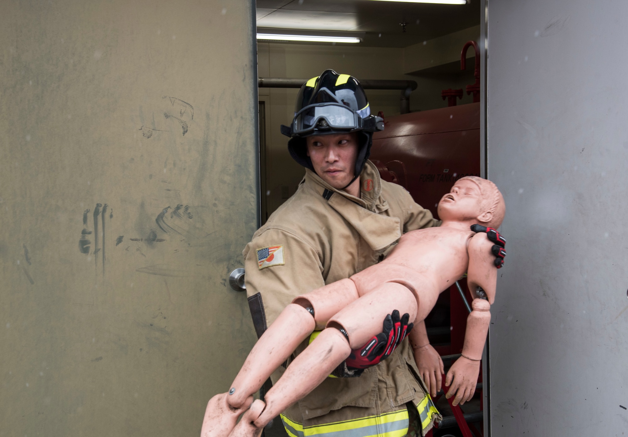 Japan Ground Self-Defense Force Sergeant Kenta Takahashi, a 1st Training Unit indirect fire infantryman, from Camp Higashi-Chitose, Hokkaido, Japan, carries a child-sized mannequin during a JGSDF shadow program at Misawa Air Base, Japan, March 5, 2018. Team Misawa played a role in the course as native English speakers. For the majority of the JGSDF Soldiers, it is the first time interacting with American service members. The JGSDF Soldiers used the English they learned by asking questions and actively engaging with Airmen. (U.S. Air Force photo by Senior Airman Sadie Colbert)