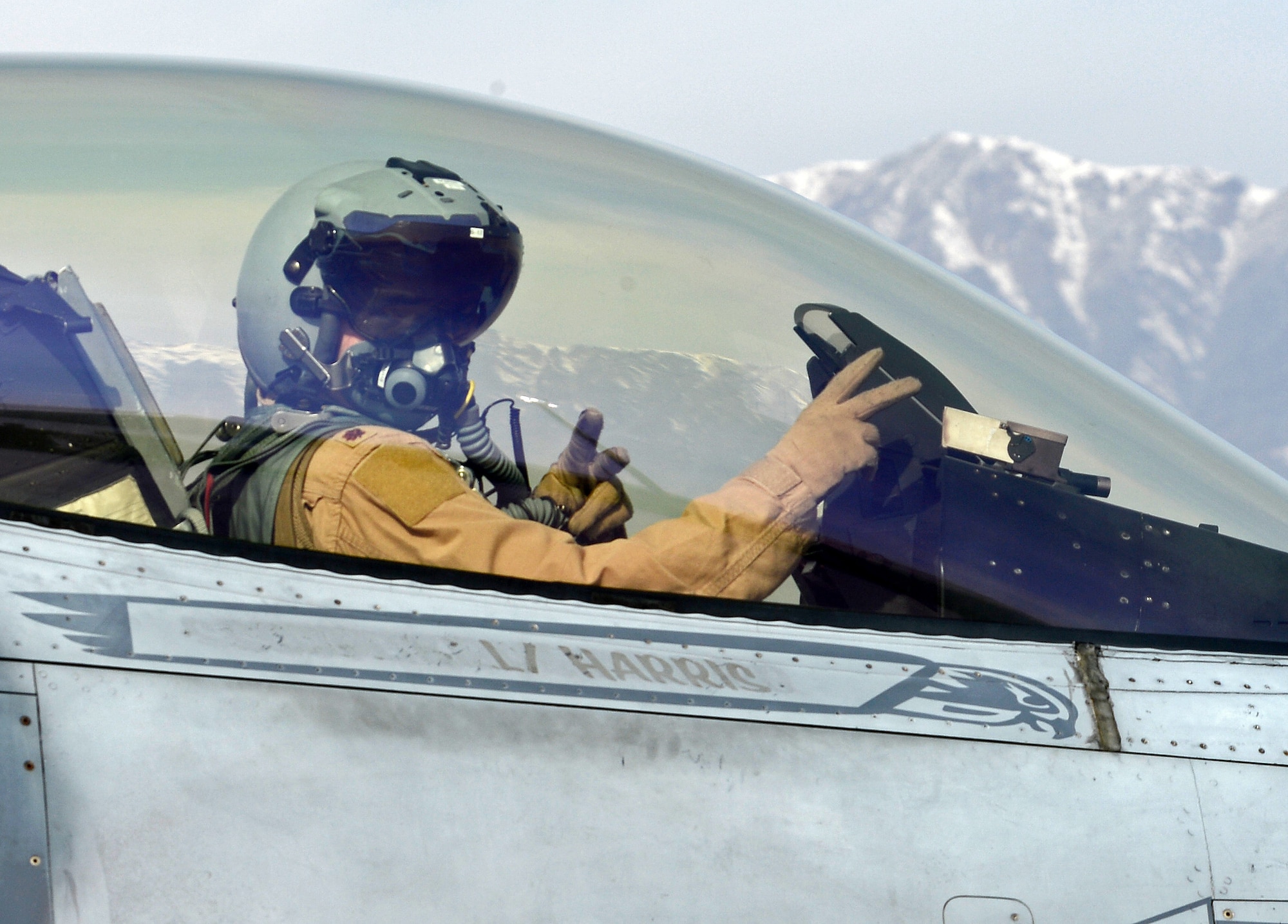 “Mach”, 77th Expeditionary Fighter Squadron F-16 Fighting Falcon fighter pilot, signals from his aircraft prior to taking off Feb. 28, 2018 at Bagram Airfield, Afghanistan.