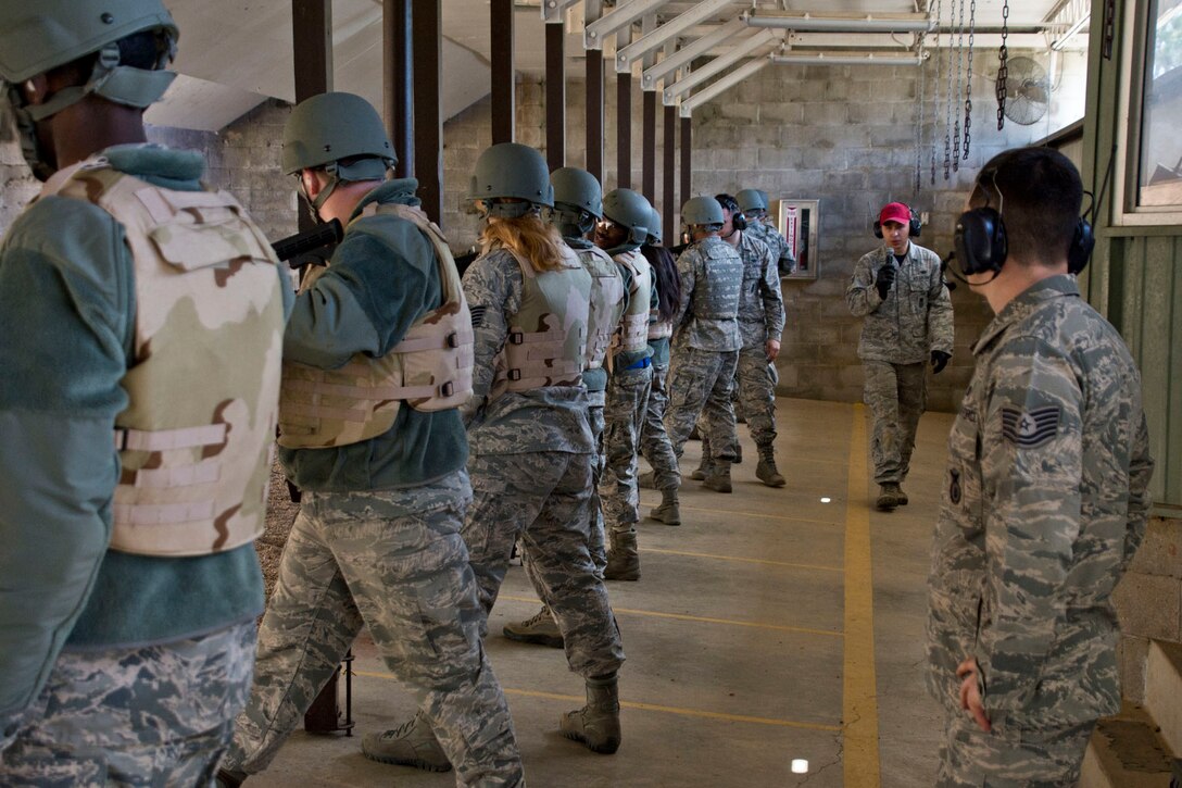 U.S. Air Force Senior Airman Ja Lee instructs Airmen from the 96th Aerial Port Squadron, when and when not to fire the M4 Carbine weapons training Feb. 10, 2018, at Little Rock Air Force Base. Ark.