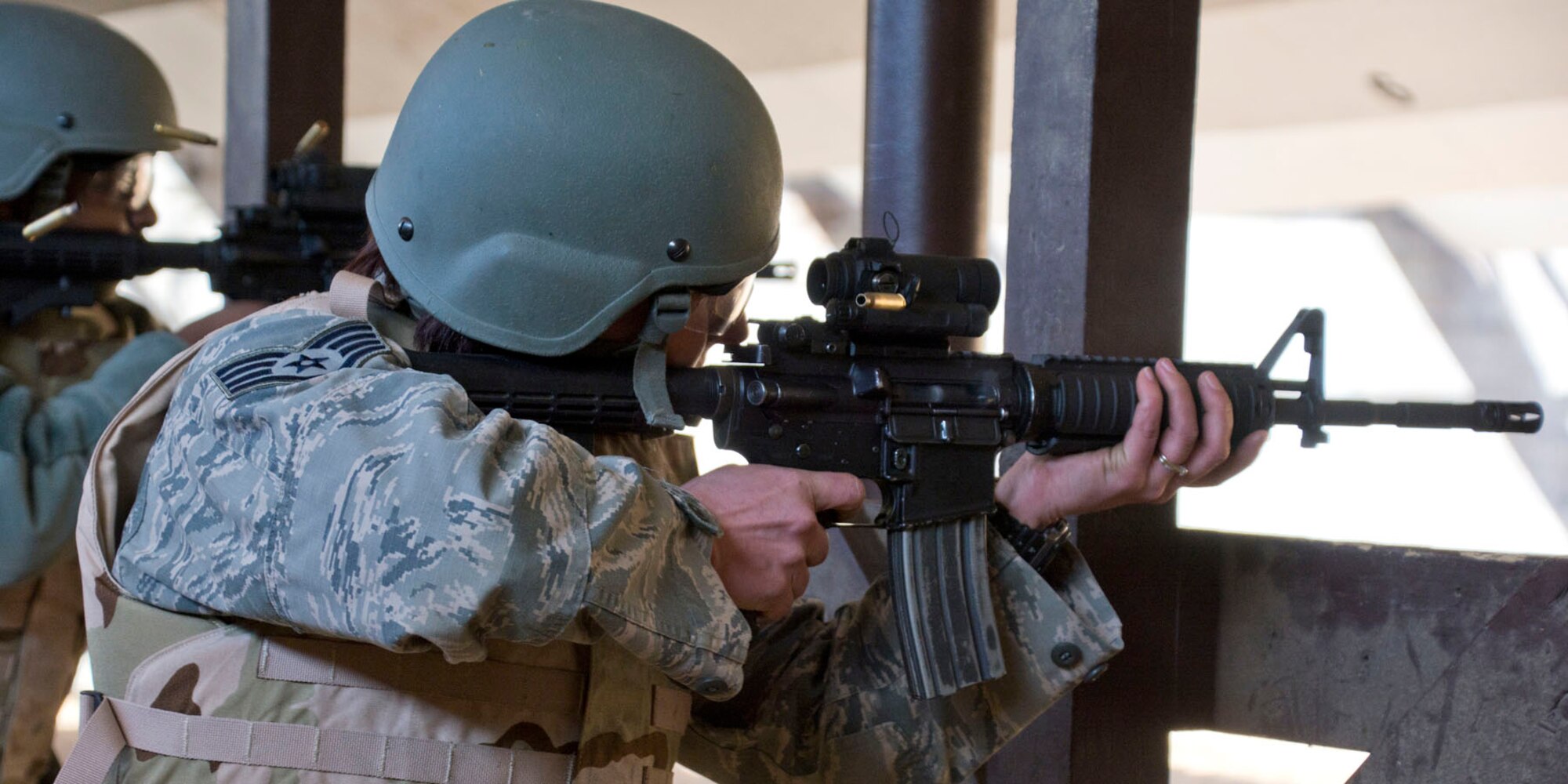 U.S. Air Force Reserve Staff Sgt. Danielle Shaw, joint inspector, 96th Aerial Port Squadron, fires a burst from an M4 Carbine during weapons training Feb. 10, 2018, at Little Rock Air Force Base. Ark.