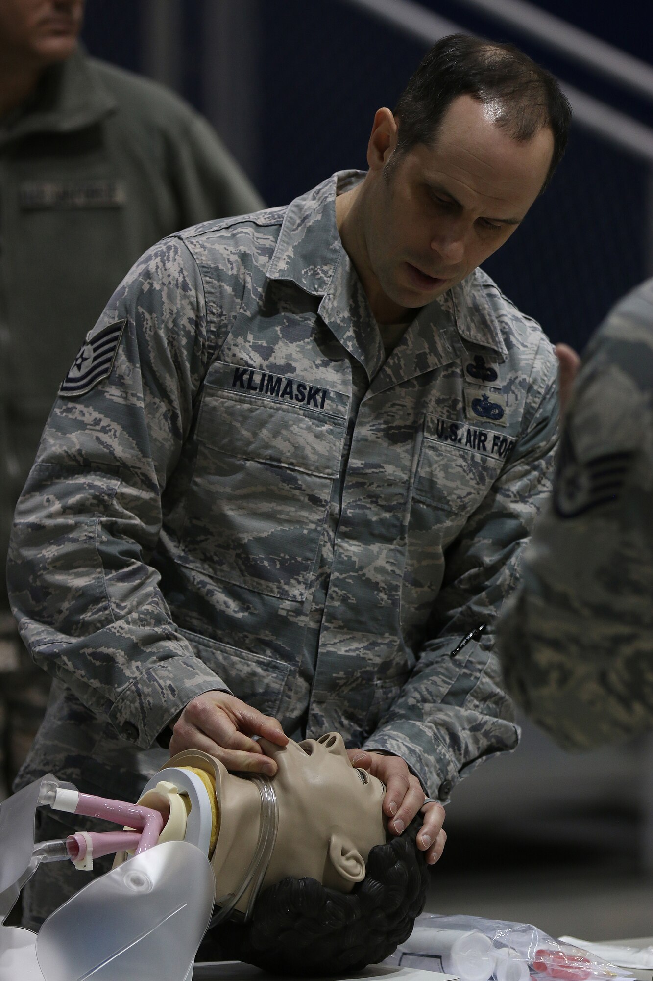 Tech. Sgt. Joseph Klimaski, 445th Airlift Wing occupational safety specialist, practices the head-tilt chin lift maneuver during the self-aid and buddy care training class held during the Feb. 11, 2018 unit training assembly.