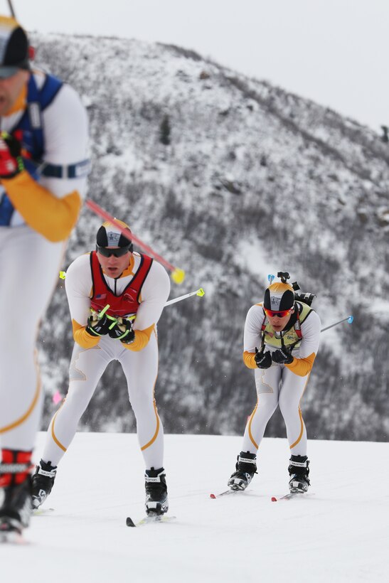A National Guard team skis in a men’s biathlon event.