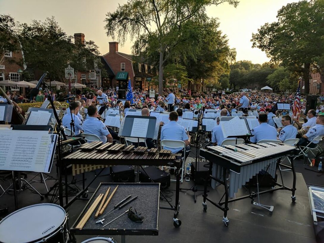 The USAF Heritage of America Band performs before a capacity crowd at a recent outdoor concert in Merchants Square, Williamsburg, Virginia.  The band regularly performs in the Hampton Roads region during the summer months.