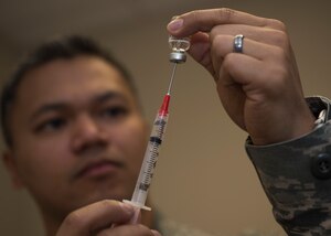 U.S. Air Force Staff Sgt. Ver Ringais, 633rd Medical Operations Squadron paramedic preps a syringe at the Langley Hospital at Joint Base Langley-Eustis, Feb. 27, 2018.
