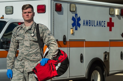 U.S. Air Force Senior Airman Michael Bray 633rd Medical Operations Squadron emergency medical technician, poses in front of the Langley Hospital at Joint Base Langley-Eustis, Feb. 22, 2018.