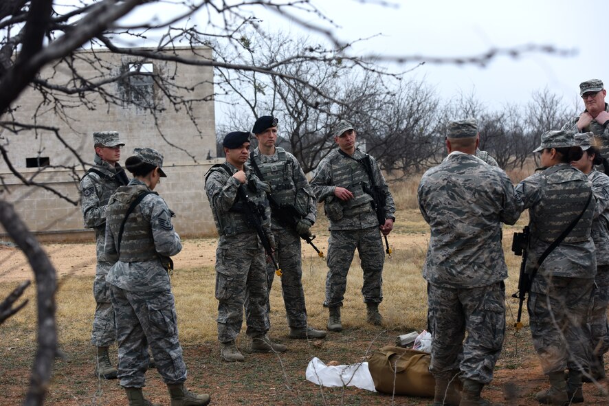 Students in the Warrior Ancillary Specialized Training Program engage in a briefing on Self-Aid and Buddy Care before their exercise at the mock Forward Operating Base on Goodfellow Air Force Base, Texas, Feb. 28, 2018. The students applied some of their knowledge during the final exercise later that day. (U.S. Air Force photo by Airman 1st Class Seraiah Hines/Released)
