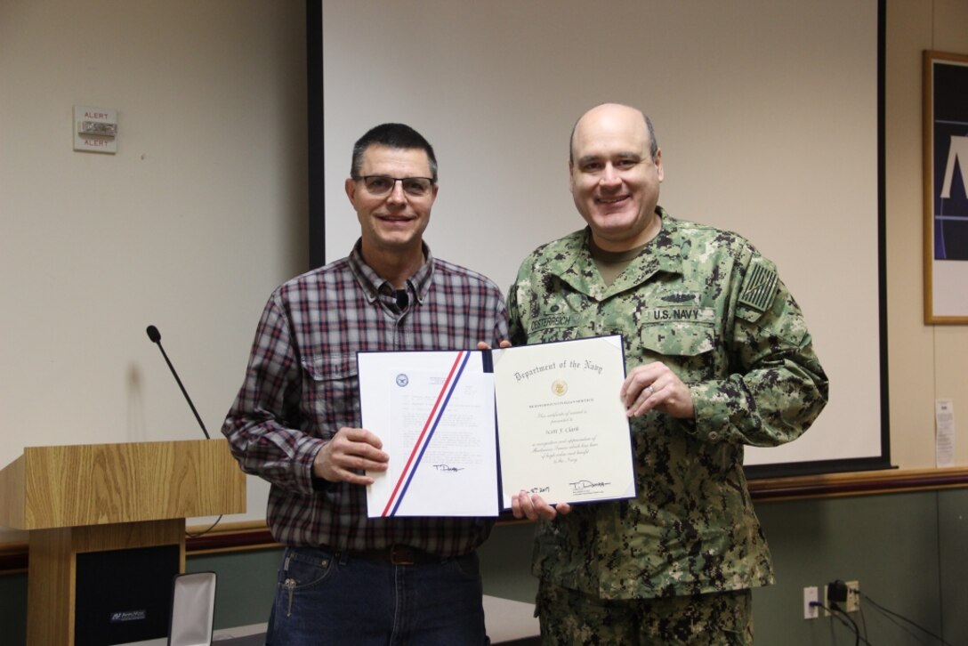 CRANE, Ind. – Scott Clark, a 33-year employee at Naval Surface Warfare Center, Crane Division (NSWC Crane), received a Navy Meritorious Civilian Service Award earlier this year in recognition of his dedicated service as the Manager and Range Control Officer for the Ordnance Test Area at Crane. 

Pictured: Scott Clark receiving his award from CAPT Mark Oesterreich, Commanding Officer at NSWC Crane.