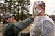 U.S. Air Force Reserve Senior Airman Jazmine Tingle, applies a pie to the face of Tech. Sgt. Christopher Holms, after the conclusion of the Unit Training Assembly (UTA) weekend at Little Rock Air Force Base, Ark., Mar. 4, 2018. Both Airmen are assigned to the 913th Aerospace Medical Squadron, and the event was used as a morale building fund raiser for the squadron. (U.S. Air Force photo by Master Sgt. Jeff Walston/Released)