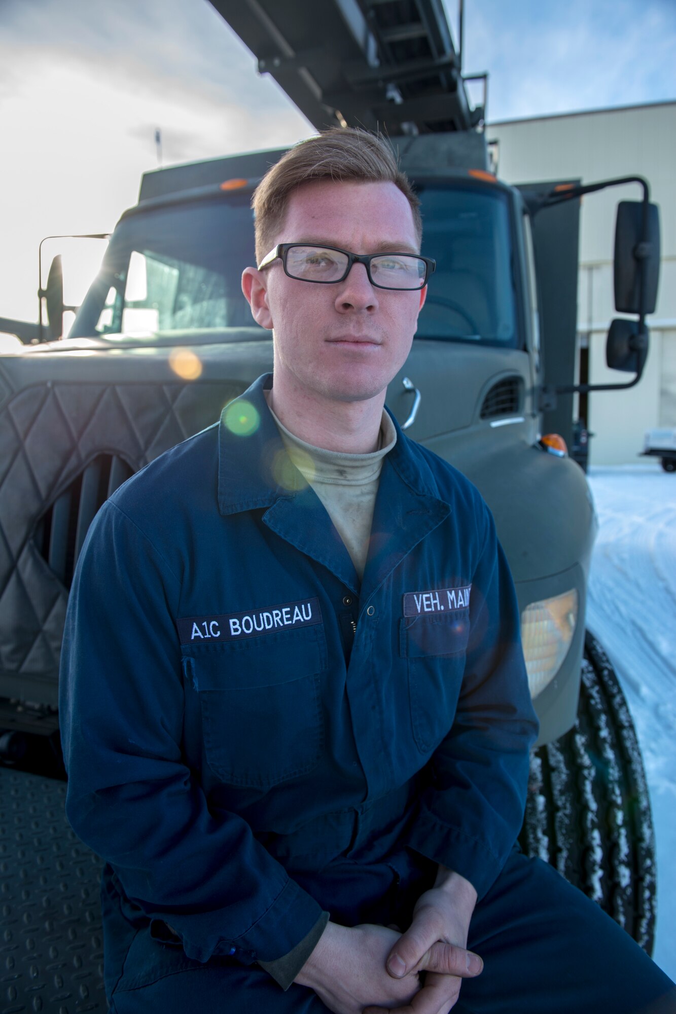 Airman 1st Class Craig Boudreau, a vehicle maintainer with the 673d Logistics Readiness Squadron, sits on an extended reach de-icer Feb. 27, 2018, at Joint Base Elmendorf-Richardson, Alaska. Boudreau was handpicked to travel with an extended-reach deicer from JBER, Alaska, to Gangneung Air Base, Republic of Korea, in support of Vice President of the United States Michael Pence’s visit to the Pyeongchang 2018 Winter Olympics.