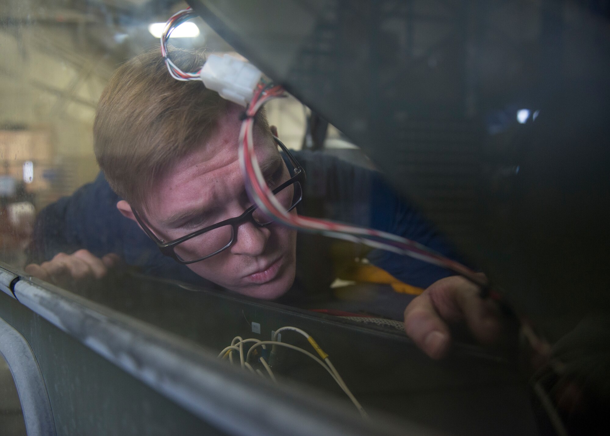 Airman 1st Class Craig Boudreau, a vehicle maintainer with the 673d Logistics Readiness Squadron, replaces a circuit breaker on a Global de-icer 1800 March 6, 2018, at Joint Base Elmendorf-Richardson, Alaska. Boudreau was handpicked to travel with an extended-reach deicer from Joint Base Elmendorf-Richardson, Alaska, to Gangneung Air Base, Republic of Korea, in support of Vice President of the United States Michael Pence’s visit to the Pyeongchang 2018 Winter Olympics.