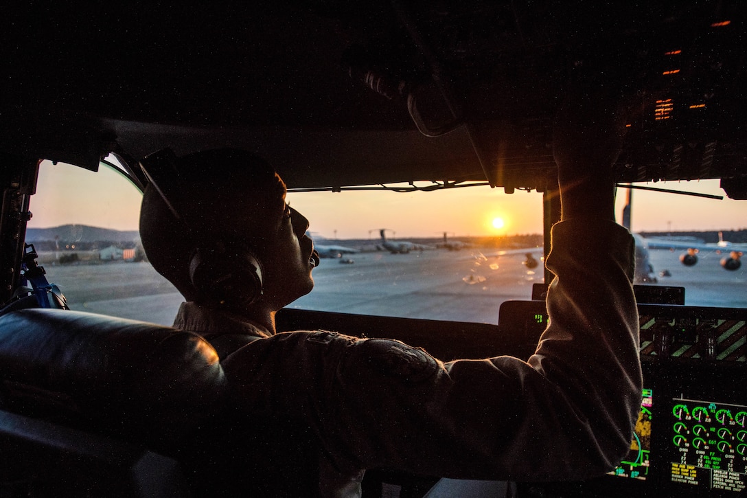 1st Lt. David Brown conducts a post flight shutdown on a C-5M Super Galaxy aircraft.