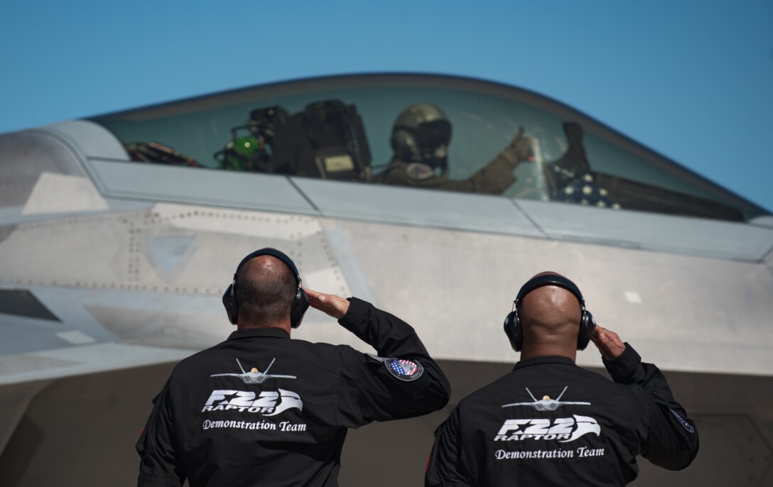 U.S. Air Force crew chiefs with the Air Combat Command F-22 Raptor Demonstration Team salute Maj. Paul “Loco” Lopez, ACC F-22 Raptor Demonstration Team commander, before taking off during the U.S. Air Force Heritage Flight Training Course at Davis-Monthan Air Force Base, Arizona, March 1, 2017.