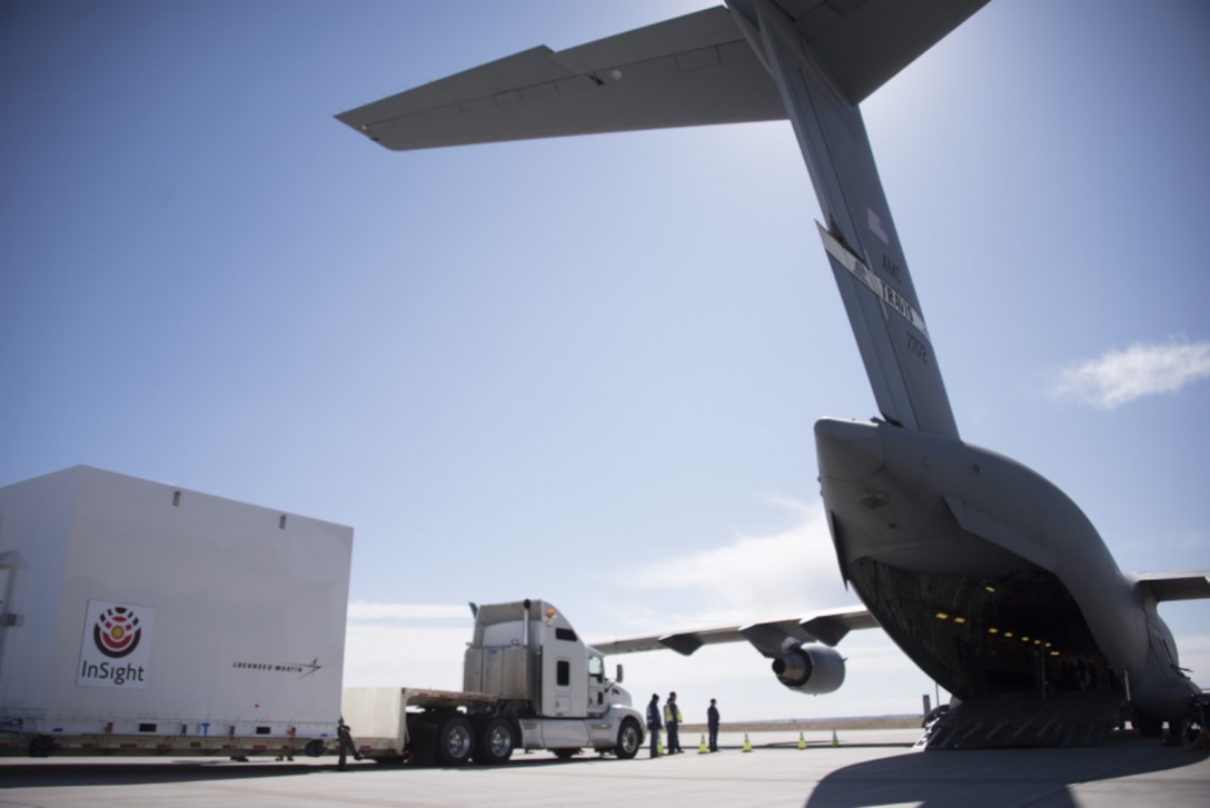 Airmen from the 21st Airlift Squadron and the 860th Aircraft Maintenance Squadron at Travis Air Force Base, California, load a NASA InSight Spacecraft onto a C-17 Globemaster III Feb. 28, 2018, at Lockheed Martin Space, Buckley Air Force Base, Colorado. The equipment was delivered to Vandenberg Air Force Base, Calif., where it will be the first planetary spacecraft to launch from the West Coast launch facility. The launch is scheduled to take place in May 2018 as part of the NASA Insight Mission to look beneath the Martian surface and study the planet’s interior. (U.S. Air Force photo by Senior Airman Amber Carter)