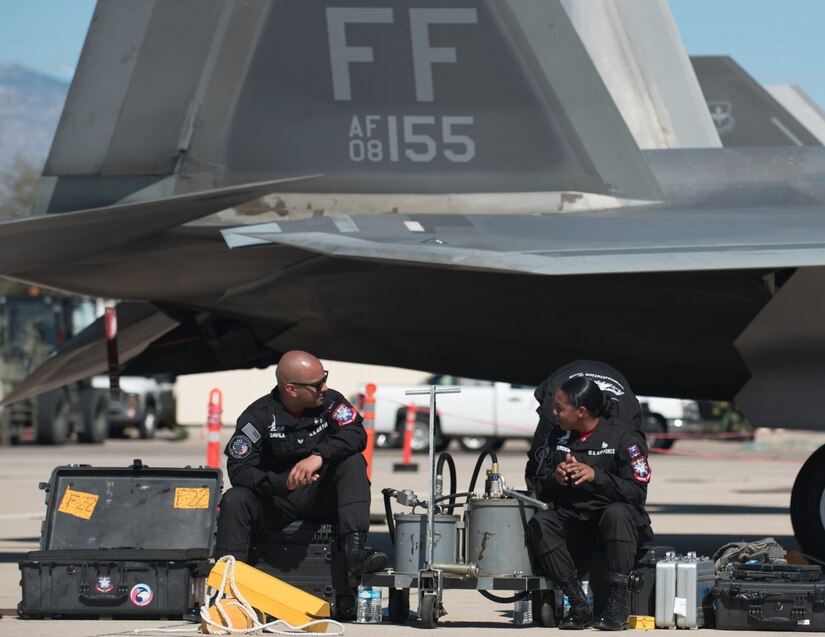 Members of the Air Combat Command F-22 Raptor Demonstation Team, take a break after launching the F-22 Raptor during the Heritage Flight Training Course at Davis-Monthan Air Force Base, Arizona, March 1, 2017.