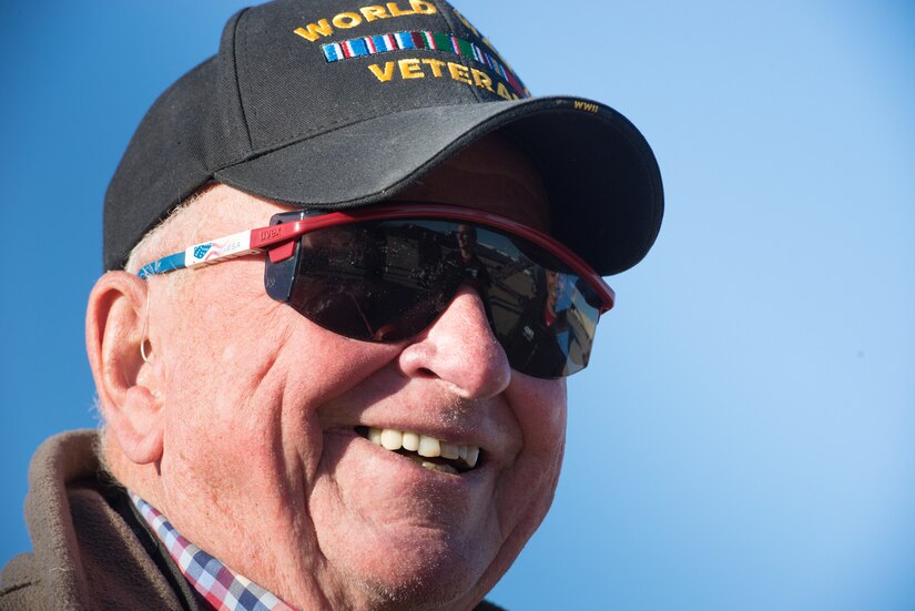 Deane Mitchell, World War II veteran and pilot, speaks with members of the Air Combat Command F-22 Raptor Demonstration Team during the U.S. Air Force Heritage Flight Training Course at Davis-Monthan Air Force Base, Arizona, March 2, 2017.