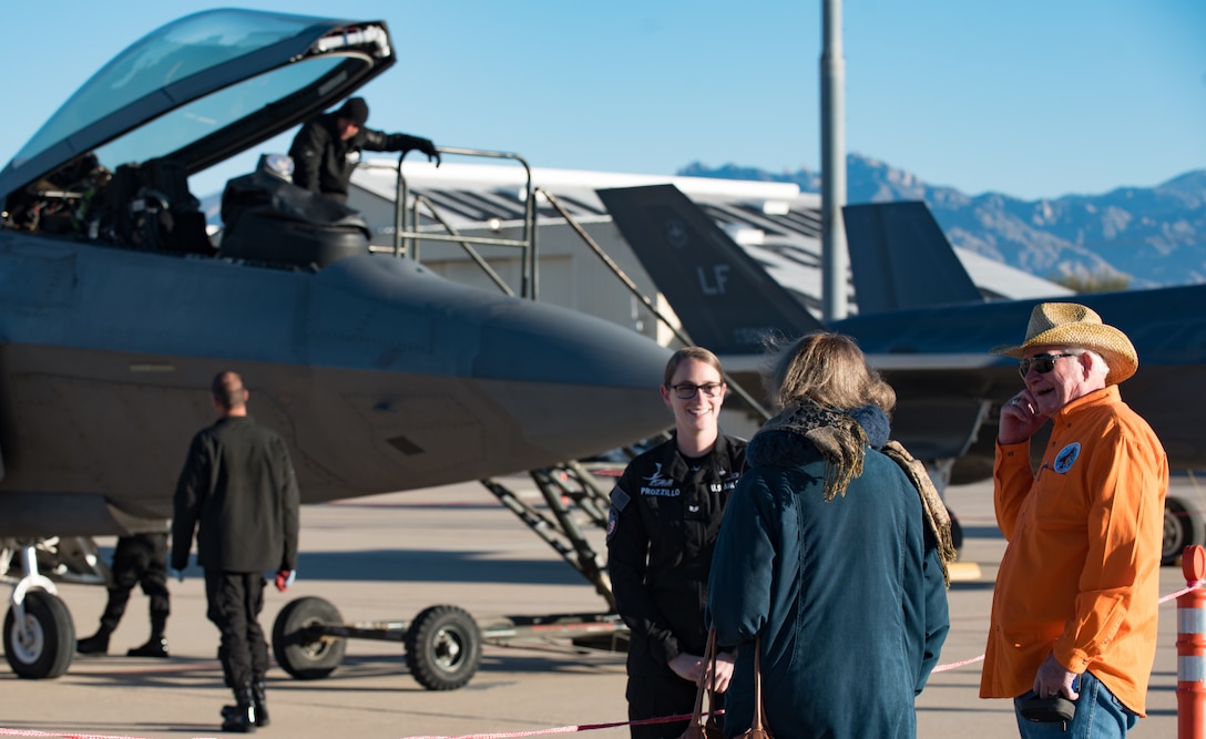 U.S. Air Force Guard Senior Airman Annemarie Prozillo, Air Combat Command Raptor Demostration Team aircrew flight equipment technician, speaks with U.S. Air Force Heritage Flight Training Course attendees at Davis-Monthan Air Force Base, Arizona, March 2, 2017.