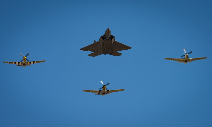 U.S. Air Force Maj. Paul “Loco” Lopez, Air Combat Command F-22 Raptor Demonstation Team, flies the F-22 Raptor in formation with P-51 Mustangs during the U.S. Air Force Heritage Flight Training Course at Davis-Monthan Air Force Base, Arizona, March 2, 2017.