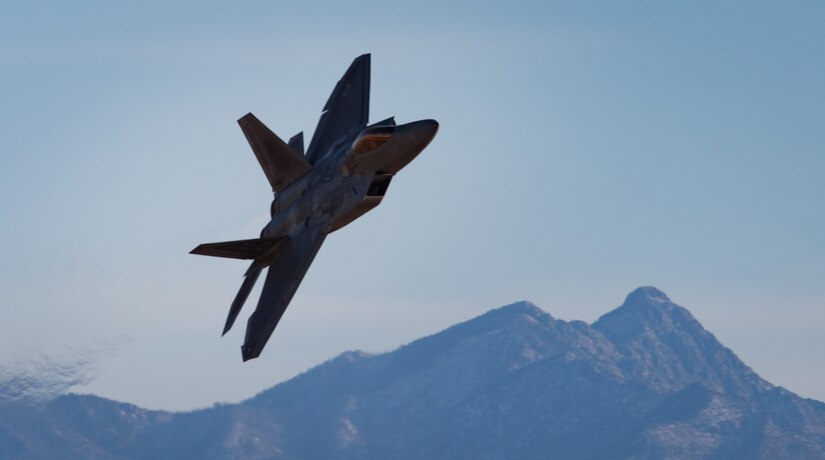 U.S. Air Force Maj. Paul “Loco” Lopez, Air Combat Command F-22 Raptor Demonstation Team, flies the F-22 Raptor, demonstrating its combat capabilities during the U.S. Air Force Heritage Flight Training Course at Davis-Monthan Air Force Base, Arizona, March 4, 2017.