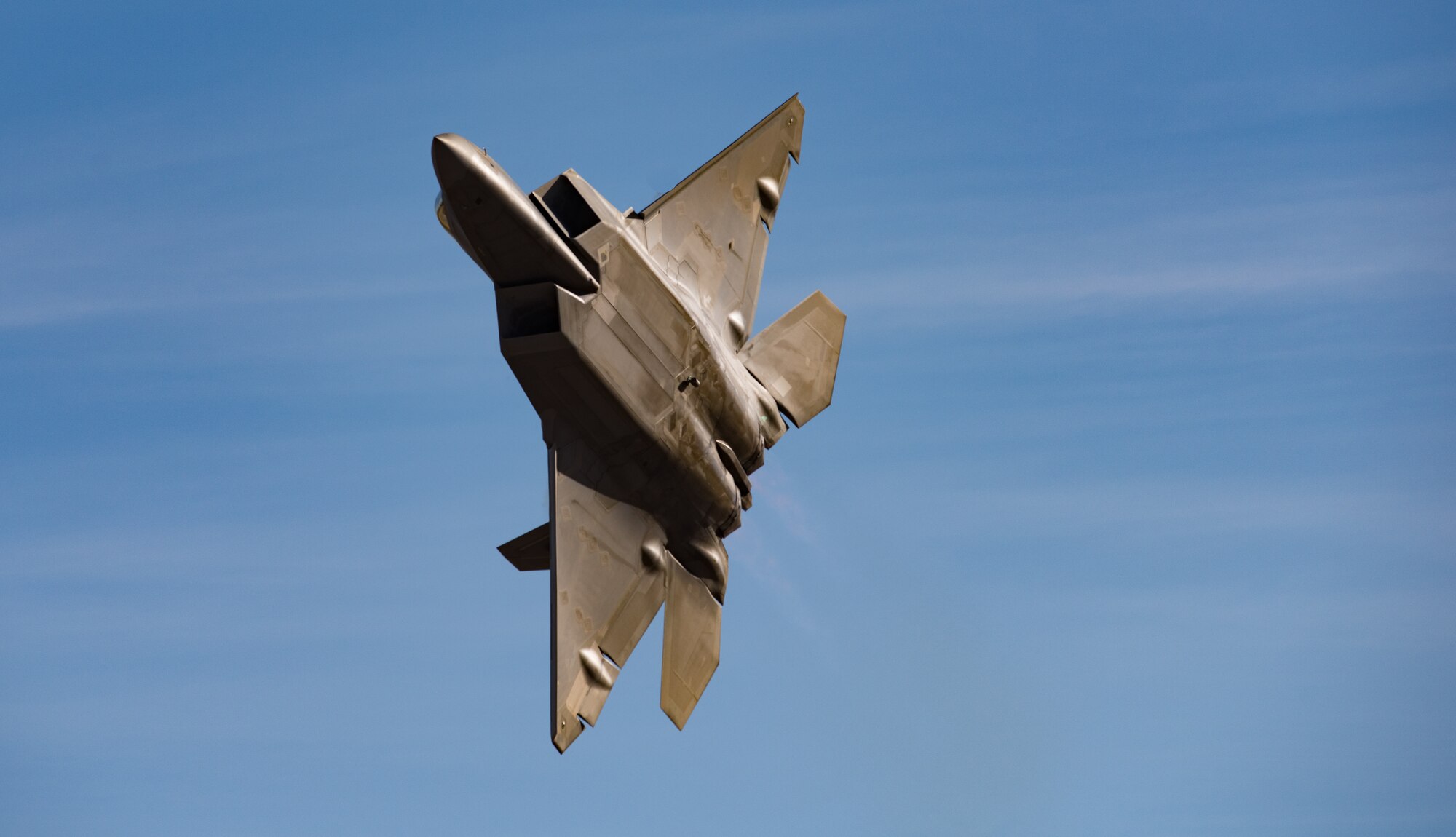 U.S. Air Force Maj. Paul “Loco” Lopez, Air Combat Command F-22 Raptor Demonstation Team, flies the F-22 Raptor, demonstrating its combat capabilities during the U.S. Air Force Heritage Flight Training Course at Davis-Monthan Air Force Base, Arizona, March 4, 2017.