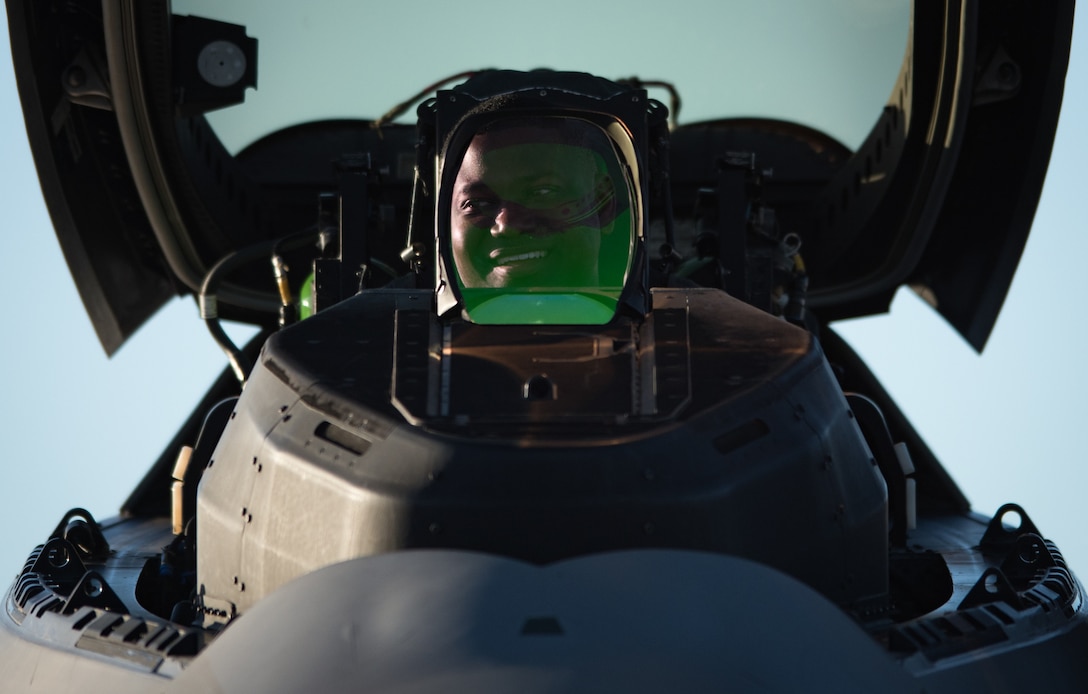 U.S. Air Force Maj. Paul “Loco” Lopez, Air Combat Command F-22 Raptor Demonstration Team commander, smiles at one of his crew chiefs after a U.S. Air Force Heritage Flight Training Course flight at Davis-Monthan Air Force Base, Arizona, March 4, 2017.