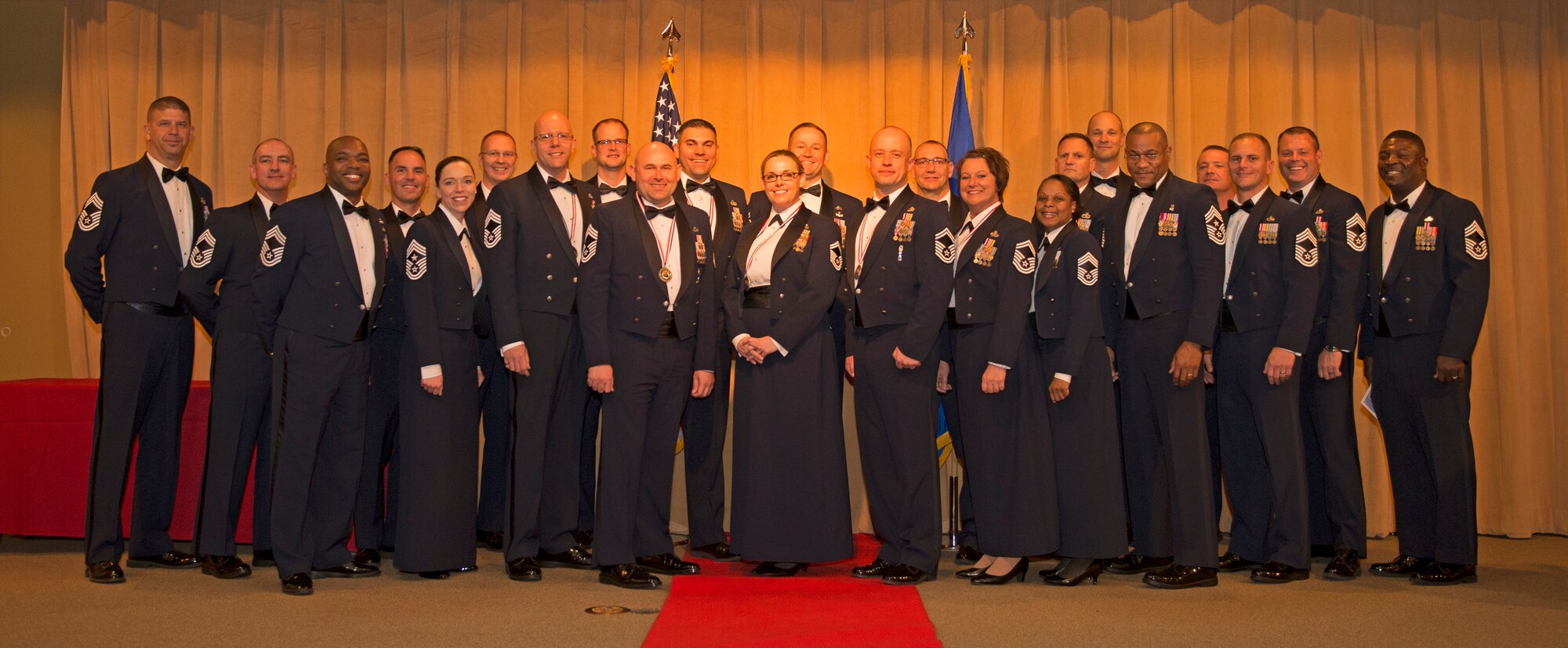 Chief selectees stand for a photo with other Chief Master Sgts. from both Luke Air Force Base, Ariz., and around the Air Force during the Luke Chief Recognition Ceremony, March 3, 2018. Chief Master Sgt. Juliet Gudgel, command chief of the Air Education and Training Command, fifth from left, was the guest speaker at the ceremony. (U.S. Air Force photo/Senior Airman Ridge Shan)