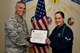 U.S. Air Force Col. Alex Ganster, 17th Training Group commander, presents the 17th TRG Student of the Month certificate to Airman 1st Class Kaylee Cardoza-Larson, 315th Training Squadron trainee, in Brandenburg Hall on Goodfellow Air Force Base, Texas, March 2, 2018. The 315th TRS’s vision is to develop combat-ready intelligence, surveillance and reconnaissance professionals and promote an innovative squadron culture and identity unmatched across The U.S. Air Force. (U.S. Air Force photo by Senior Airman Randall Moose/Released)