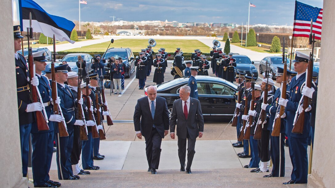 Defense Secretary James N. Mattis walks up steps at Pentagon with his Estonian counterpart.