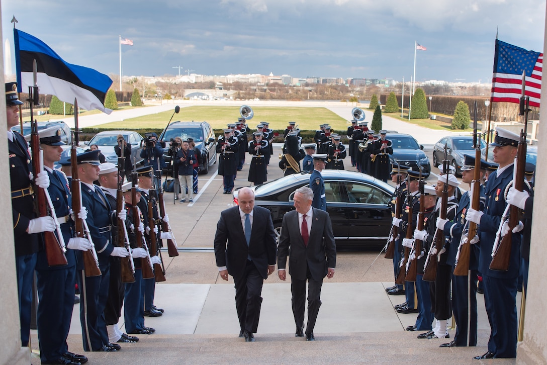 Defense Secretary James N. Mattis walks up steps at Pentagon with his Estonian counterpart.