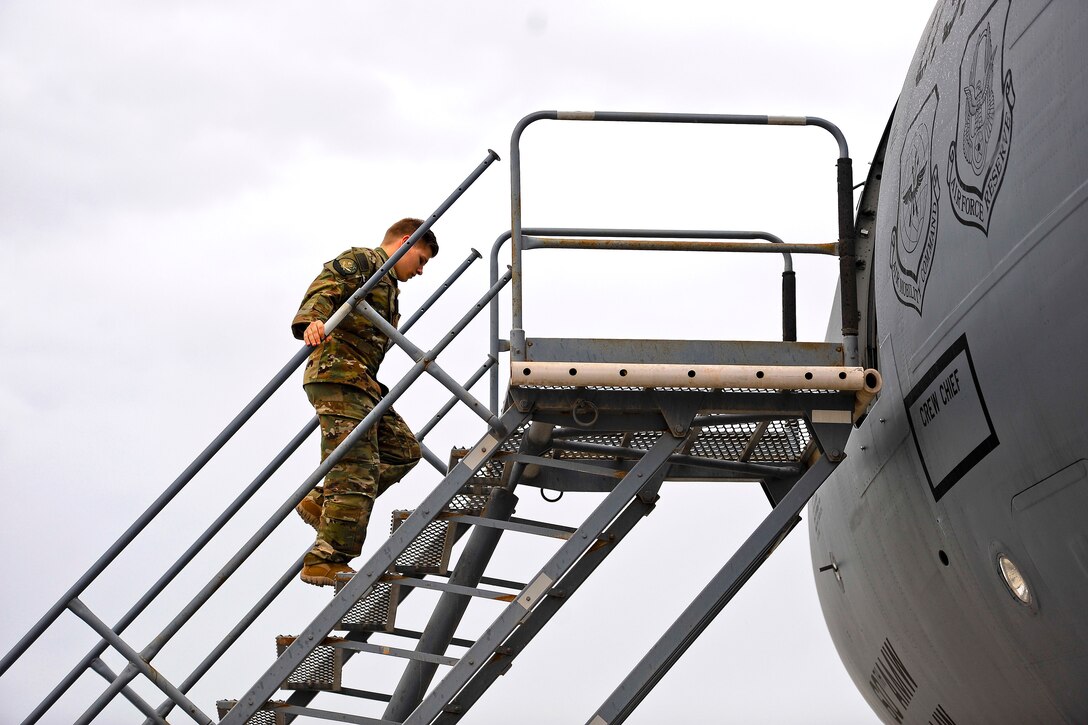 An airman prepares to board a KC-10 Extender aircraft.